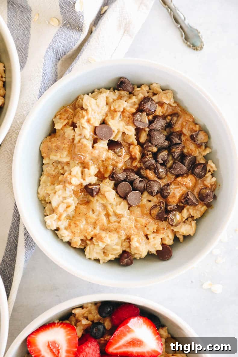 Mastering Your Morning Oats 12 A rich bowl of oatmeal lavishly topped with melted chocolate chips and a generous swirl of creamy peanut butter, mimicking the flavors of a classic peanut butter cup.
