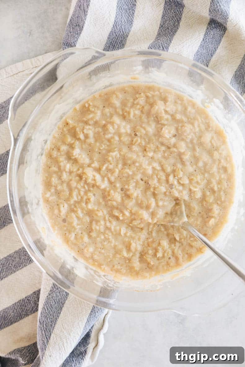 Mastering Your Morning Oats 7 A perfectly cooked bowl of creamy oatmeal, just removed from the microwave, topped with fresh fruit and ready to eat.