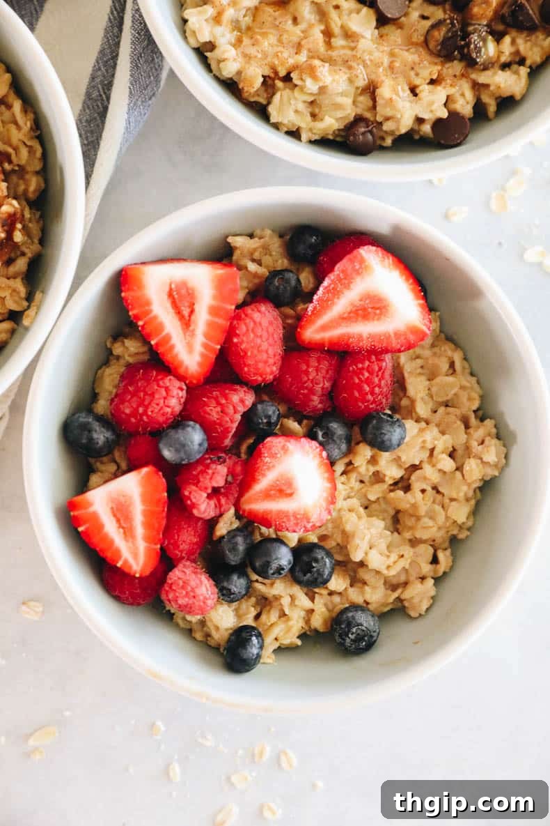 Mastering Your Morning Oats 9 A vibrant bowl of oatmeal generously topped with an assortment of fresh mixed berries, including strawberries, blueberries, and raspberries, creating a colorful and healthy breakfast.