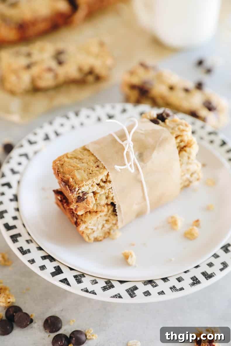 Power-Packed Protein Granola Bars 6 Stacked protein granola bars, wrapped with parchment paper and tied with a string for gifting or storage.