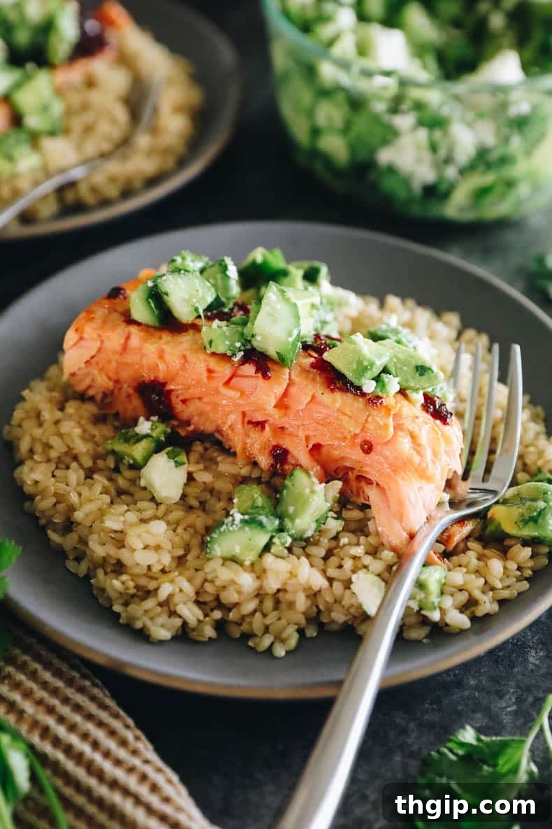 chipotle salmon with avocado salsa on a bed of brown rice.