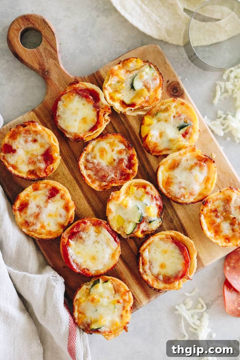 Freshly baked mini tortilla pizzas displayed on a brown cutting board, showcasing perfectly melted cheese and crispy edges, garnished with vibrant green herbs.