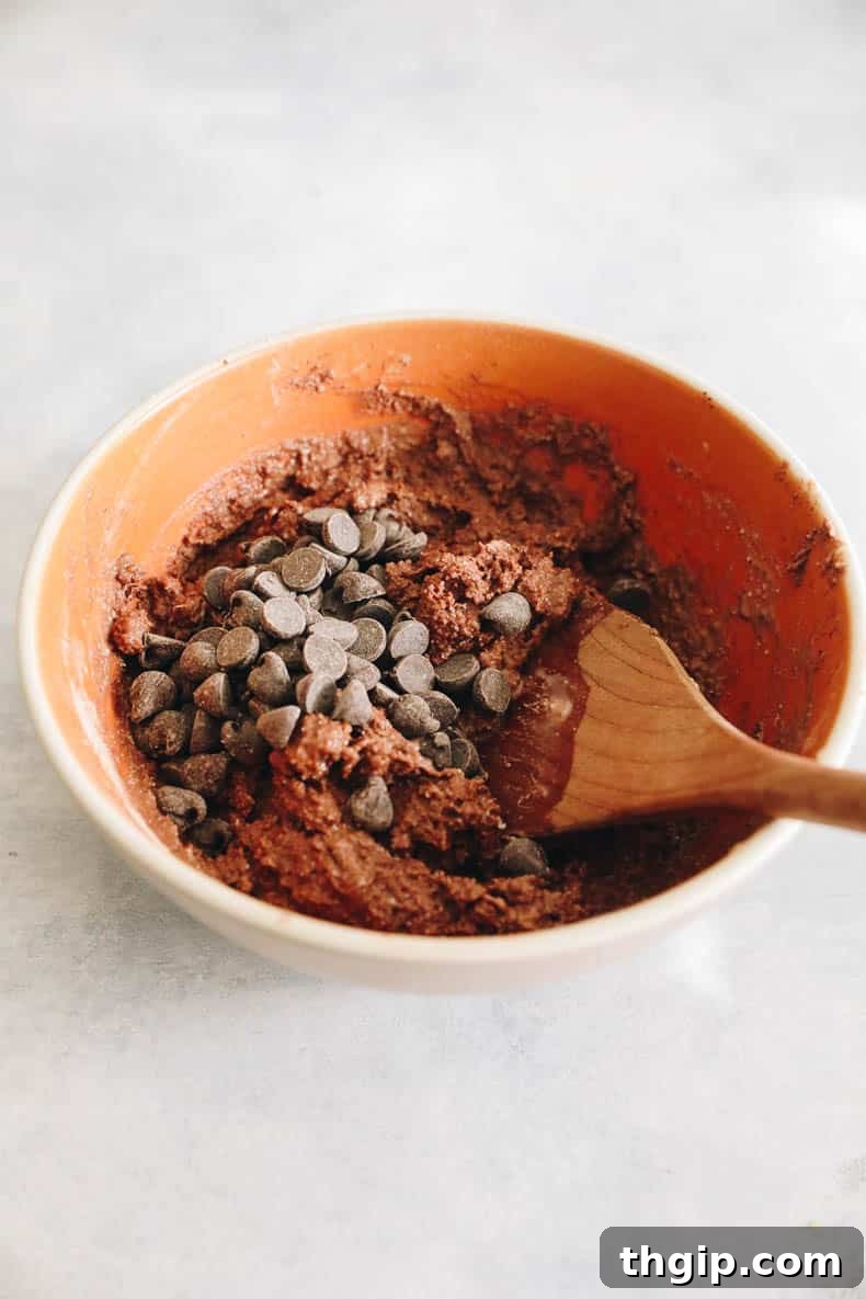 Guilt-Free Protein-Packed Brownies 4 protein brownie batter in a bowl, with chocolate chips folded in.