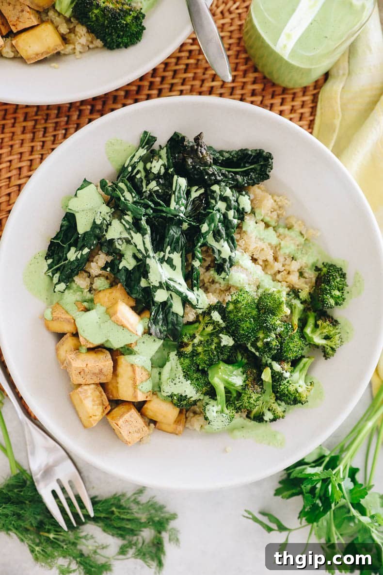 Overhead view of a vibrant Green Goddess Tofu Bowl in a white shallow bowl, ready to be enjoyed.