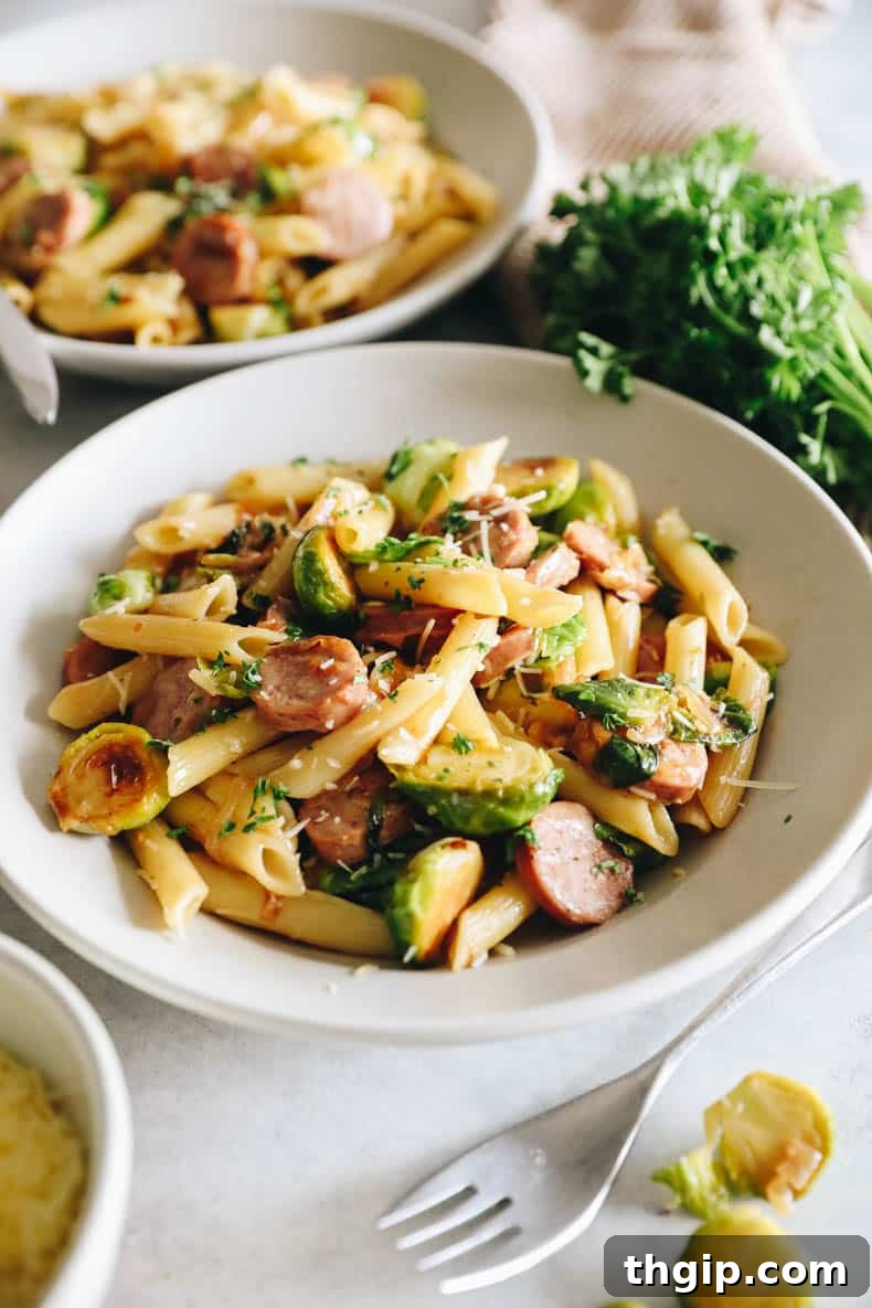 Hearty Chicken Sausage Pasta 2 Hearty Chicken Sausage Pasta with Brussels Sprouts in a large pot, ready to be served.