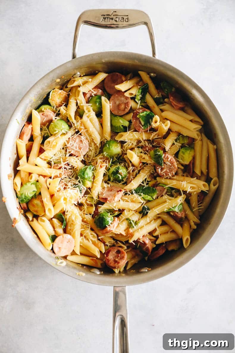 Hearty Chicken Sausage Pasta 5 The completed Chicken Sausage Pasta tossed in a creamy white wine sauce, still in the large pot.