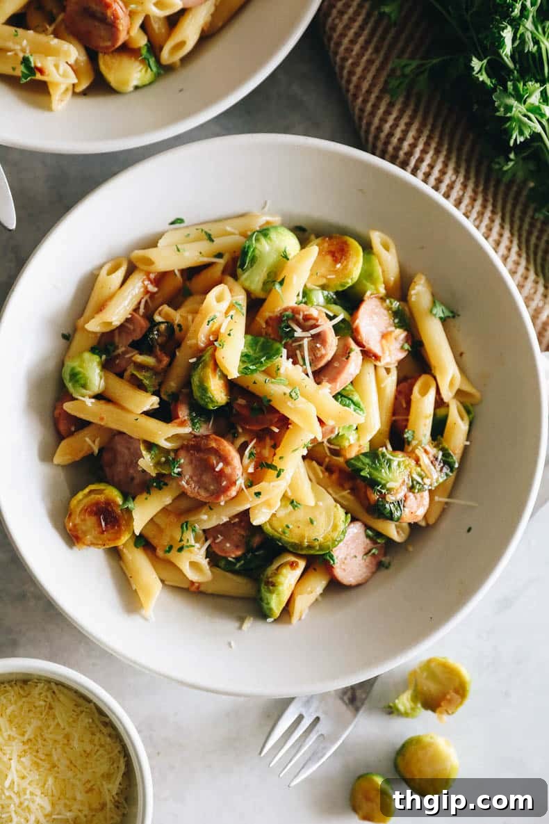 Hearty Chicken Sausage Pasta 8 An overhead shot of a large pot filled with Chicken Sausage Pasta and Brussels Sprouts, ready to be served.