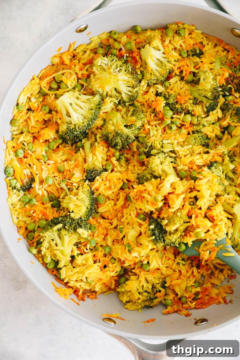 Fragrant Coconut Curry Rice with Vegetables 4 curry rice with broccoli, peas, carrot in a caraway pot.