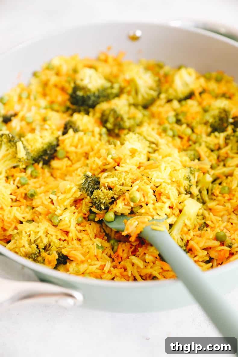 Fragrant Coconut Curry Rice with Vegetables 8 curried rice pilaf in a ceramic dish, ready to serve.
