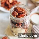 sweet and spicy roasted pecans in a mason jar
