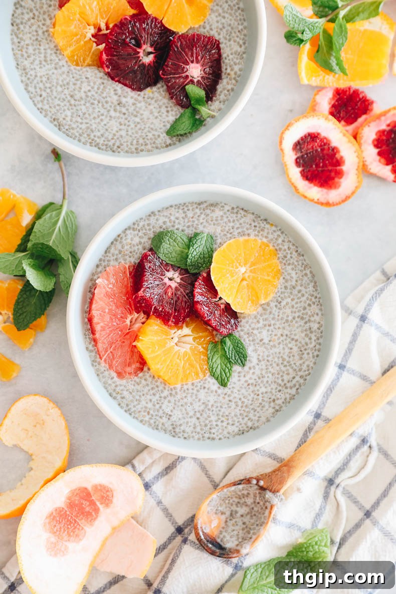 Sunshine Citrus Chia Pudding 4 Prepared 5-minute chia pudding in a bowl, artfully topped with a colorful assortment of fresh winter citrus slices including grapefruit, blood orange, and tangelo, ready to be enjoyed.