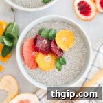 close up image of chia pudding in a blue and white bowl with grapefruit, blood orange and tangelo.