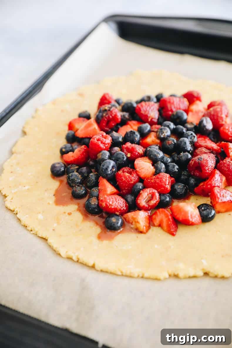 Berry Galette with Almond Flour Crust 7 Filling the center of the galette crust with mixed berries, leaving a border.