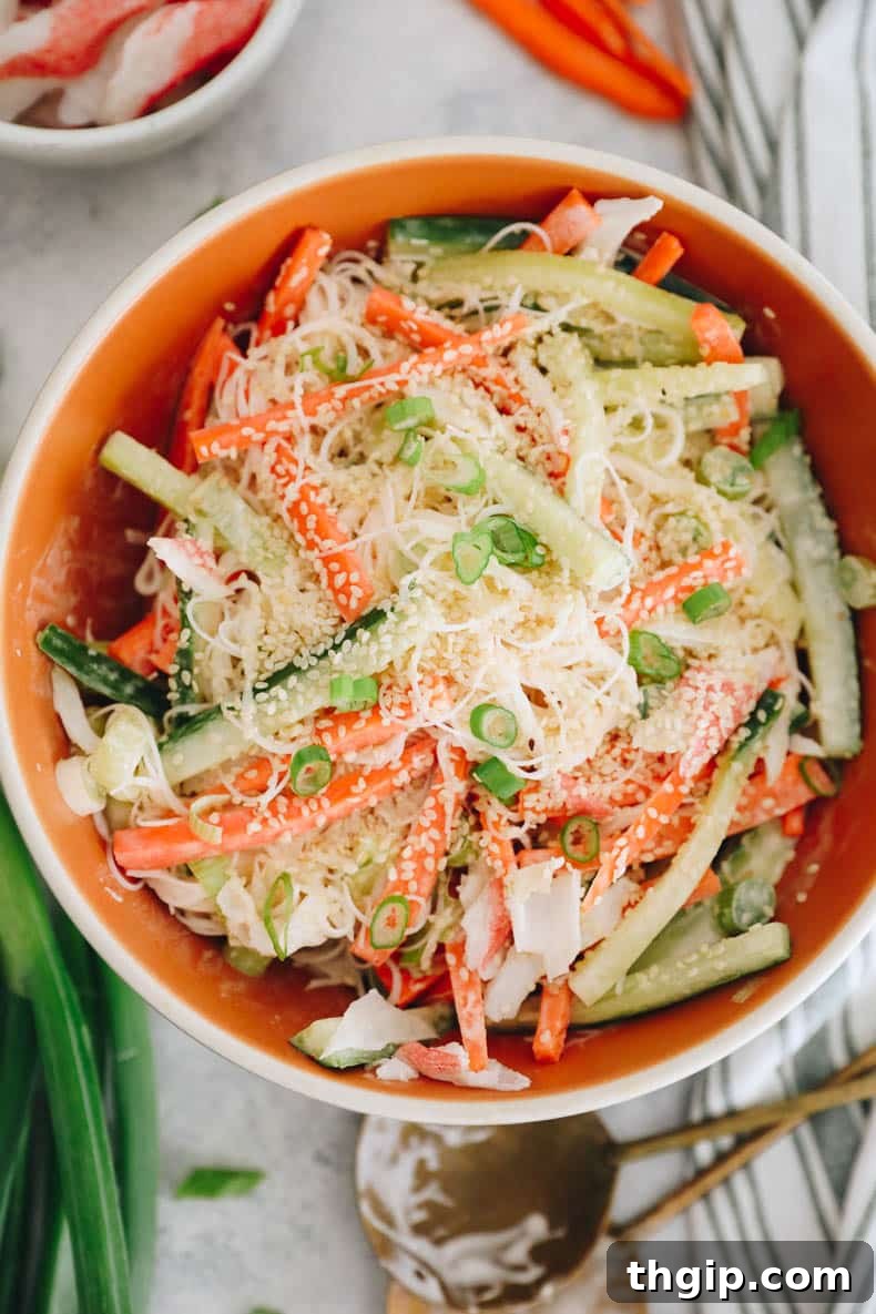 Creamy Spicy Crab Crunch 8 A close-up shot of a healthy and fresh Kani Salad, showcasing its delightful textures and vibrant colors, garnished with extra sesame seeds.