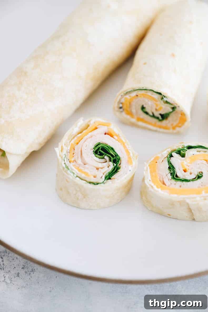Swirl Bites 5 turkey pinwheel sandwiches on a white plate