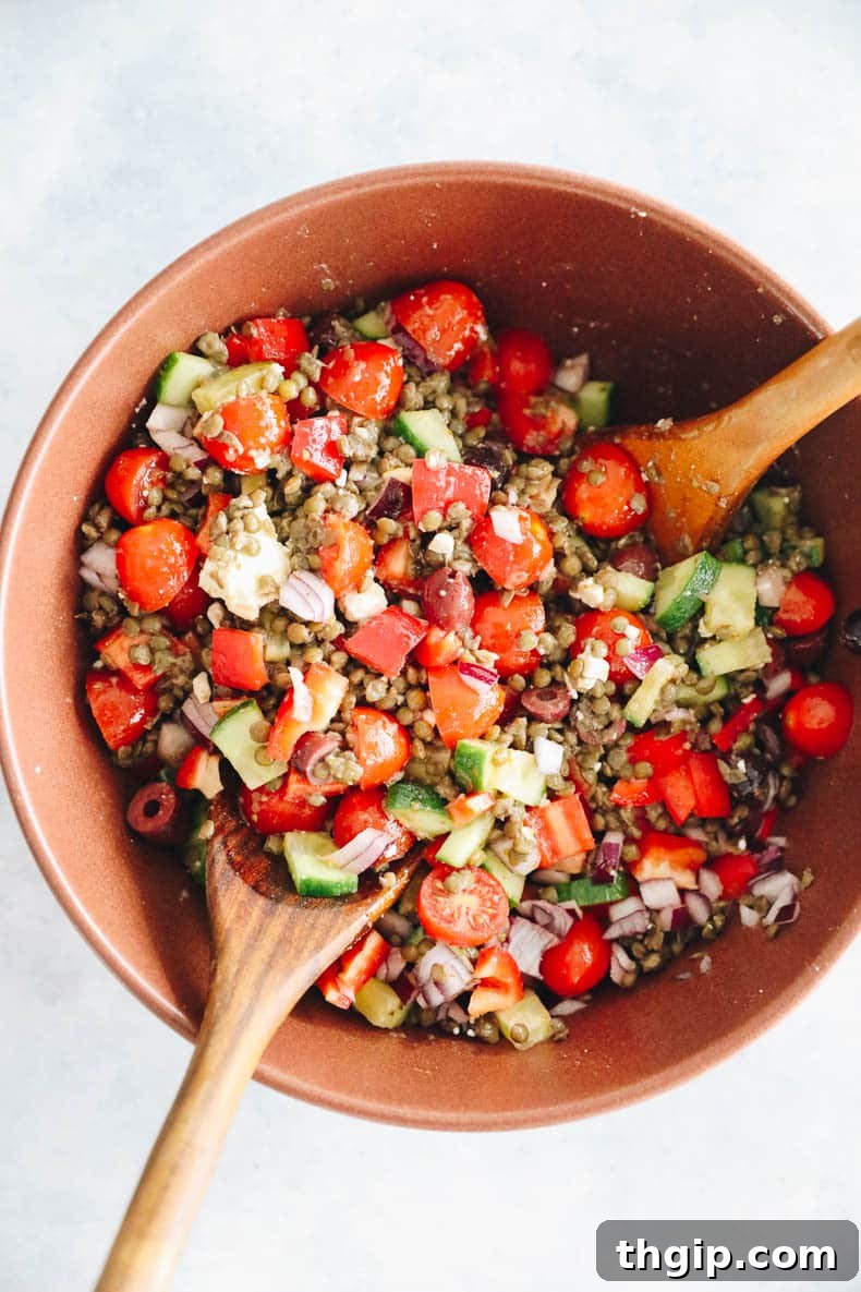 Vibrant Lentil Salad 5 A large brown bowl with lentil salad.