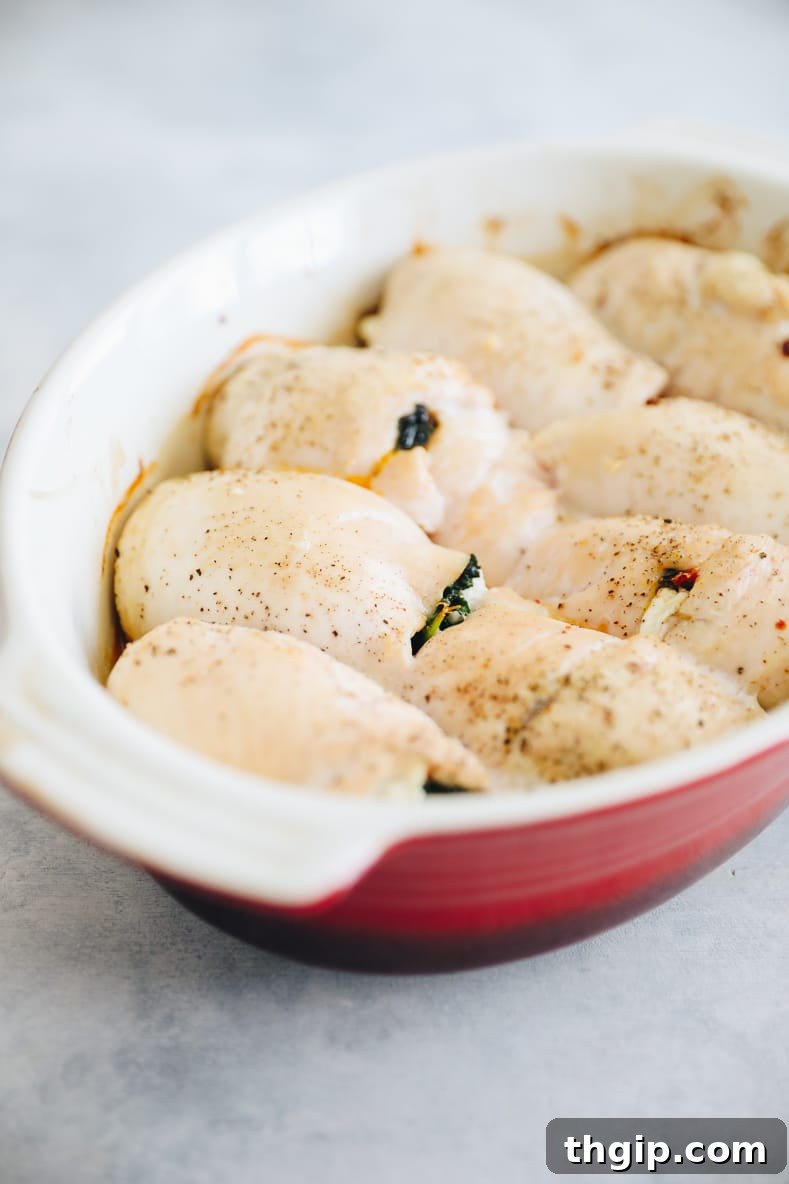 Baked kale and sundried tomato stuffed chicken, golden brown and ready to serve.
