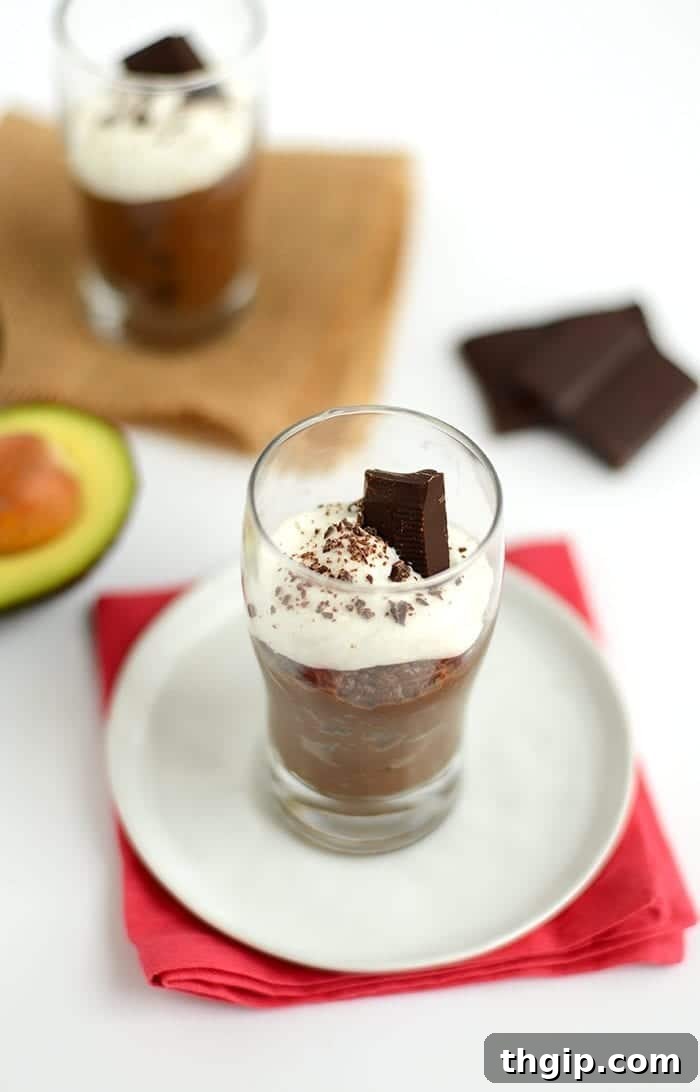 Salted Dark Chocolate Mousse served in a small glass jar, garnished with chocolate shavings