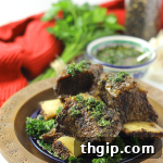 A beautifully plated serving of Chimichurri Braised Short Ribs.