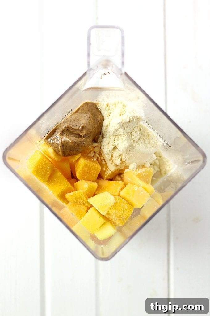 Tropical Mango Almond Bliss 3 Start your day with this creamy and delicious Mango Almond Butter Smoothie. Made with frozen mango, banana, almond butter and milk and protein powder this breakfast smoothie recipe will keep you full for hours!