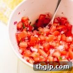 Perfect Pico de Gallo Made Easy 2 Pico de Gallo served on patacones with a lime wedge.