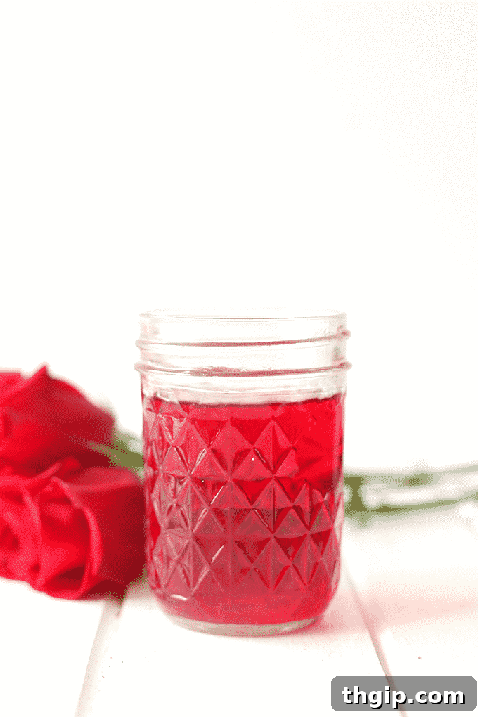 Evde Mis Kokulu Gül Suyu ve Tonik Yapımı 4 A mason jar filled with freshly made homemade rose water, ready for use