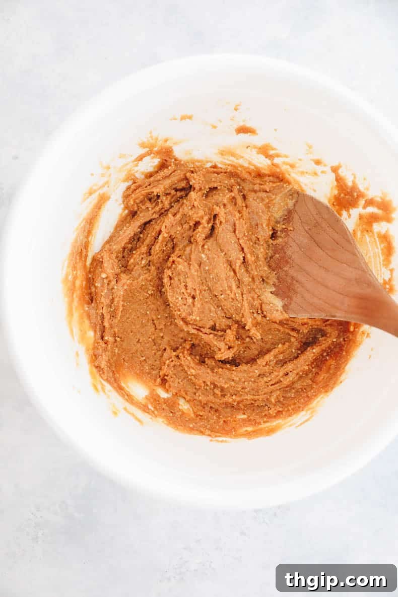Wholesome Peanut Butter Treats 3 Peanut butter cookie dough mixed in a white bowl, showing its smooth and thick consistency.