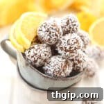 A small bowl filled with Lemon Coconut Energy Balls, ready for a healthy snack.
