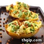 Thumbnail image of Pesto Spaghetti Squash with Spicy Roasted Chickpeas, ready to eat.