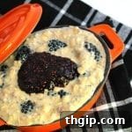 Overnight Blackberry Coconut Oats in a serving bowl, garnished with fresh fruit.