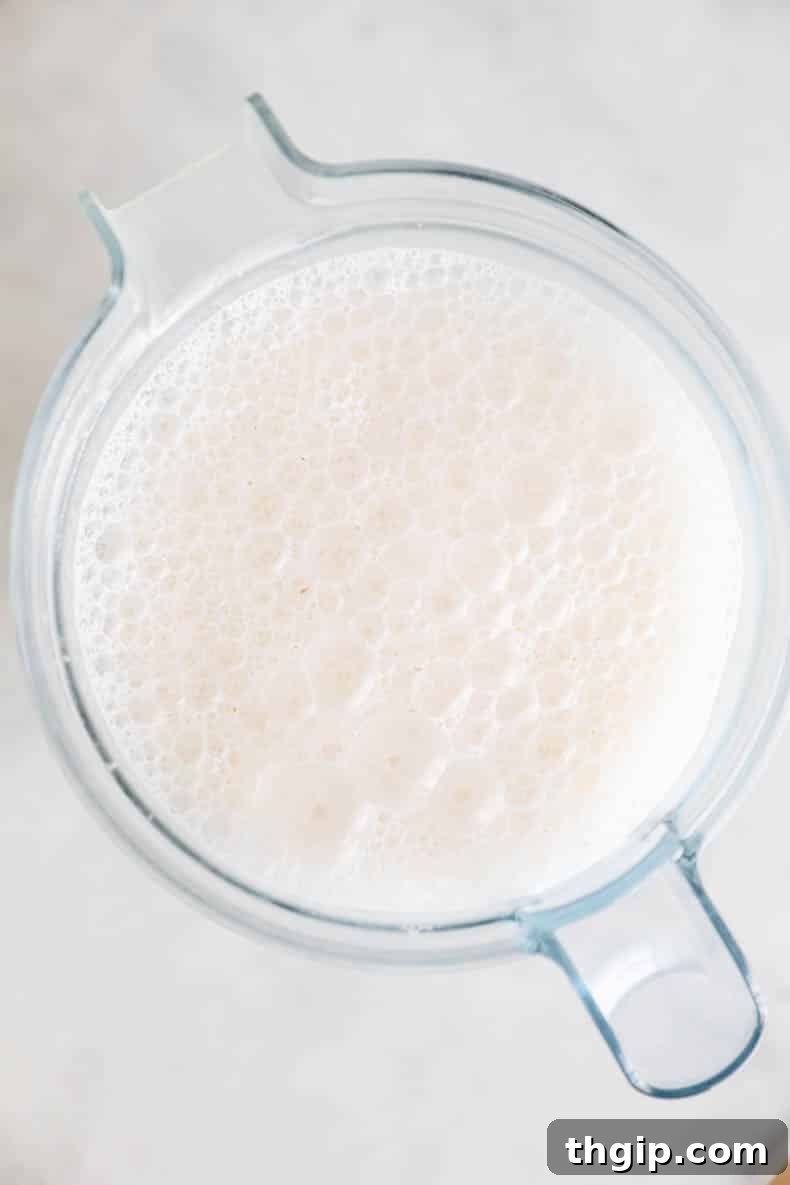 Create Your Own Creamy Almond Milk 4 Foamy, blended almond milk mixture in a high-speed blender.